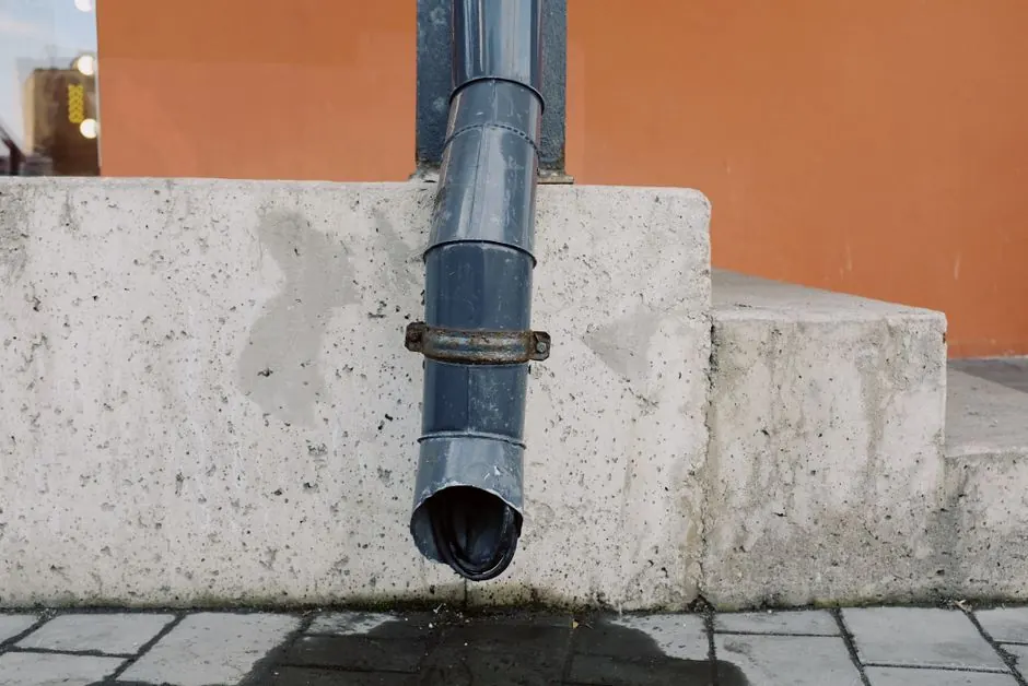 Downspout cleaning service preventing water damage in Torrance